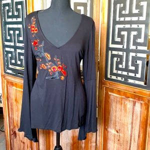 Black top with embroidered floral detail